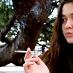 First pic of Russian Smokers | Young brunette is taking an unhurried stroll with allwhite 120mm cigarette