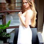 First pic of Sophie Sparks undresses her white dress to show her shaved pussy on the couch