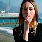 Fourth pic of Russian Smokers | Slim chick basks in the sun with a cigarette in her hand