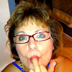 First pic of Bustyblisss - Hot Busty Housewife Poses in her blue bikini wearing glasses