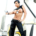 Third pic of Exotica: Foxy brunette cop Exotica strips... - Babes and Pornstars