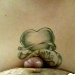 Second pic of Busty tattooed chick takes it from behind - AmateurPorn