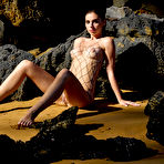 Fourth pic of Irina Sivalnaya peels off her bathing suit on an exotic island