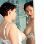 Third pic of Modern Grandma Nata loves to play with her dildo and her pussy in the bathroom - Mature.nl