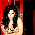 Fourth pic of Sunny Leone looks hot as she goes down on the bathroom floor and fingers her pussy
