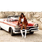 First pic of Putri Cinta exposes her big boobs and bubble butt posing around the car