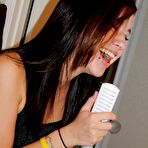 Third pic of Tattooed brunette girl showing her ass in a mini skirt 15 photos