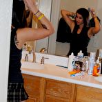 Fourth pic of Tattooed brunette girl showing her ass in a mini skirt 15 photos