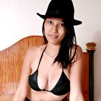 First pic of Lonely Asian MILF posing nude on her bed and fingering her pussy