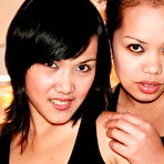 First pic of Two young naked Asian beauties caressing and licking each other on a bed