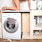 Third pic of Short haired MILF Anhen gets wet in the laundry room - Mature.nl