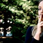 Third pic of Russian Smokers | Blond lady is smoking white cigarette outdoors