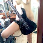 Second pic of Good looking brunette with a phone and guitar