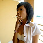 Second pic of Slim Asian teen flashing her tiny boobies and her hairy muff