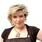 First pic of Mature piano teacher Marianna strips naked and rubs her hairy twat - NakedPics