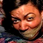 Second pic of tied-and-gagged.com | 27 Yr OLD BEAUTY SALON OWNER IS HOG-TIED, BAREFOOT, TOE-TIED, DOUBLE WRAP TAPE GAGGED, ASS SPANKED AND FOOT TICKLED (D75-3)