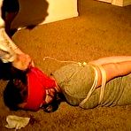 Fourth pic of tied-and-gagged.com | 25 Yr OLD NEWS PAPER REPORTER IS BALL-GAGGED, HOG-TIED, DROOLING, FEET TAPED IN PLASTIC, SPANKED AND BLINDFOLDED  (D74-6)