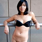 Second pic of Sexy Asian beauty dropping her g-string to show her treasures