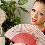 First pic of Sultry Latina pornstar Yuri Luv licks a glass butt plug before masturbating