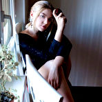 First pic of Erotic young Daniel Sea strips at her desk to spread her long legs wide open