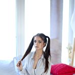 First pic of Young looking girl Tata plays with her long pigtails while baring her hot body