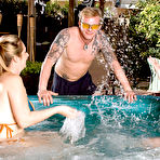 Second pic of Big titted females Brandy Talore & April Mckenzie tug on a cock in the hot tub