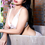Second pic of Dark haired Asian beauty Norah bathes naked in a wooden tub