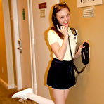 Second pic of Skinny brunette teen Audrey Star posing in a skimpy skirt outdoors