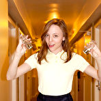 Fourth pic of Skinny brunette teen Audrey Star posing in a skimpy skirt outdoors