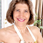 First pic of Horny older granny naked in her apron toying with rolling pin in the kitchen