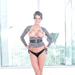 Second pic of Brunette MILF Peta Jensen unveiling hooters and pink pussy in high heels