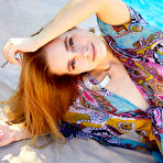 First pic of Teen model Cassia works her nice body free of a robe while next to a pool