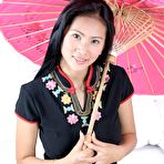 First pic of Busty Thai babe opens her legs wide and slides a sex toy deep inside her cunt