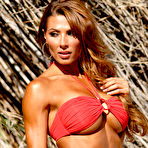 Second pic of Redheaded fitness model Lauren Hunter models a red bikini in a pleasing manner