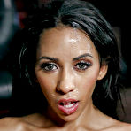 Fourth pic of Ebony office worker Priya Price giving BJ on knees in skirt and stockings