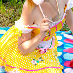 First pic of Adorable teen Alana uncovers her full breasts while going nude near the water