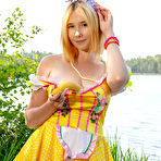 Second pic of Adorable teen Alana uncovers her full breasts while going nude near the water