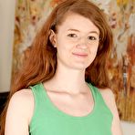 First pic of Pale redhead Abbey Rain shows her flexibility while stretching pussy lips wide