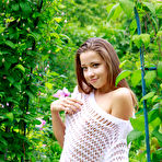 First pic of Pretty faced teen Taissia A flashing tiny boobs outdoors in the garden