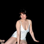 Third pic of Older amateur Hotmilf exposes her shaved pussy during a solo show