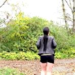 Fourth pic of Shameless MILF Corin with a hairy snatch squats in public and takes a piss