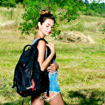 First pic of Adorable teen Georgia undresses for nude poses under a tree in a field