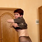 Second pic of Mature woman in pantyhose with small saggy boobs spreading her ass