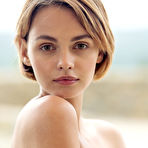 Fourth pic of Gorgeous female Ariel A slips off a mesh bodysuit to model nude on a patio