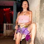 Fourth pic of Mature lady Diana Ananta bares her tits and twat on the patio and in breezeway