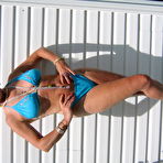 Third pic of Mature blonde Ruth frees her tits and ass from a bikini in sunglasses