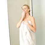 Fourth pic of Naked blonde Naughty Allie rocks her big tits while taking a shower