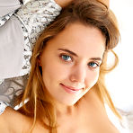 Third pic of Leggy teen with blue eyes Mango A showcases her shaved pussy in the nude