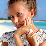 Fourth pic of Glamour babe Mango A displaying phat teen ass and shaved pussy on beach