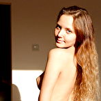 Second pic of Pretty babe with shaved pussy posing naked and slipping on her top